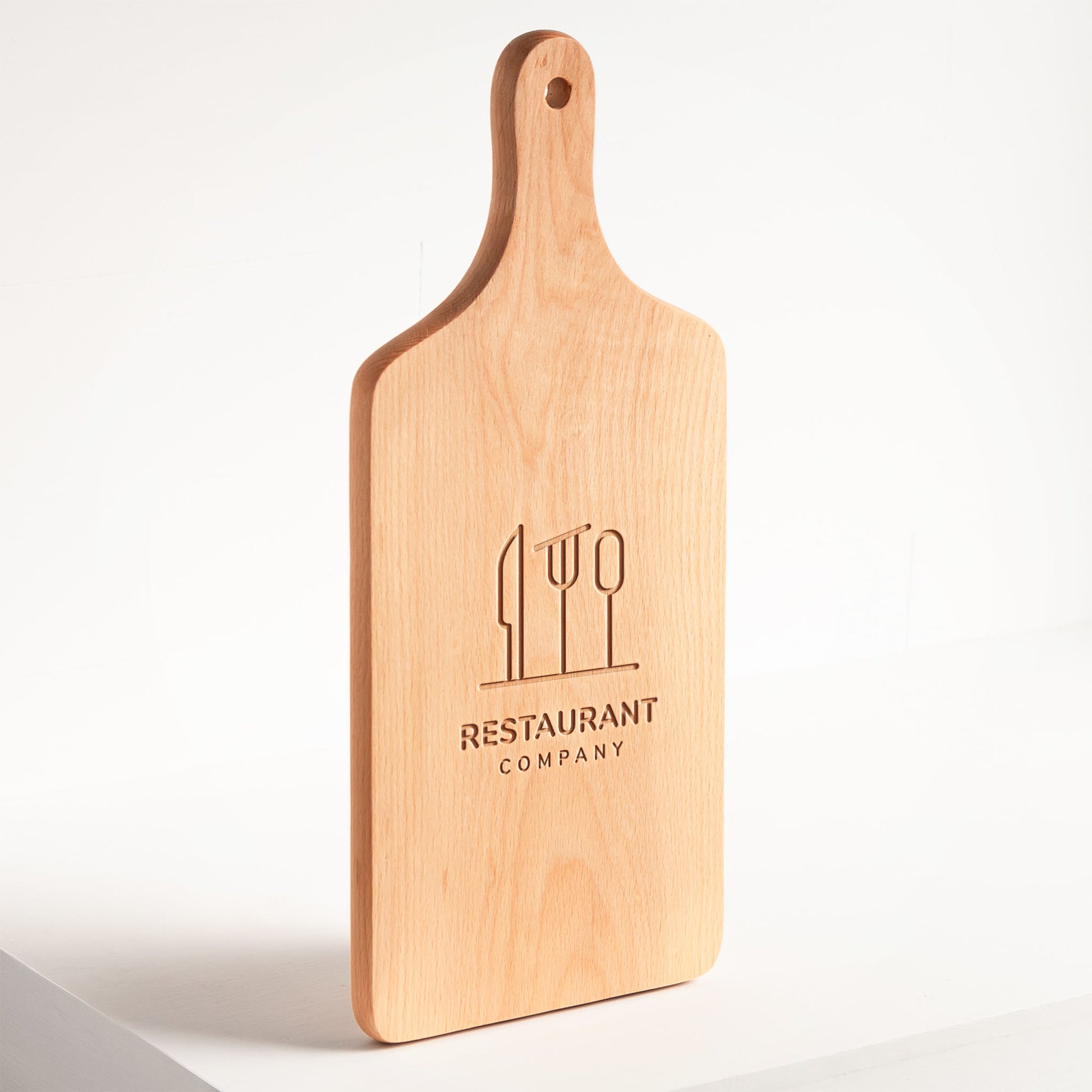 Wooden cutting board with 'Restaurant Company' branding on a white background