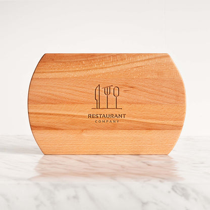 Wooden cutting board with 'Restaurant Company' logo on a marble surface