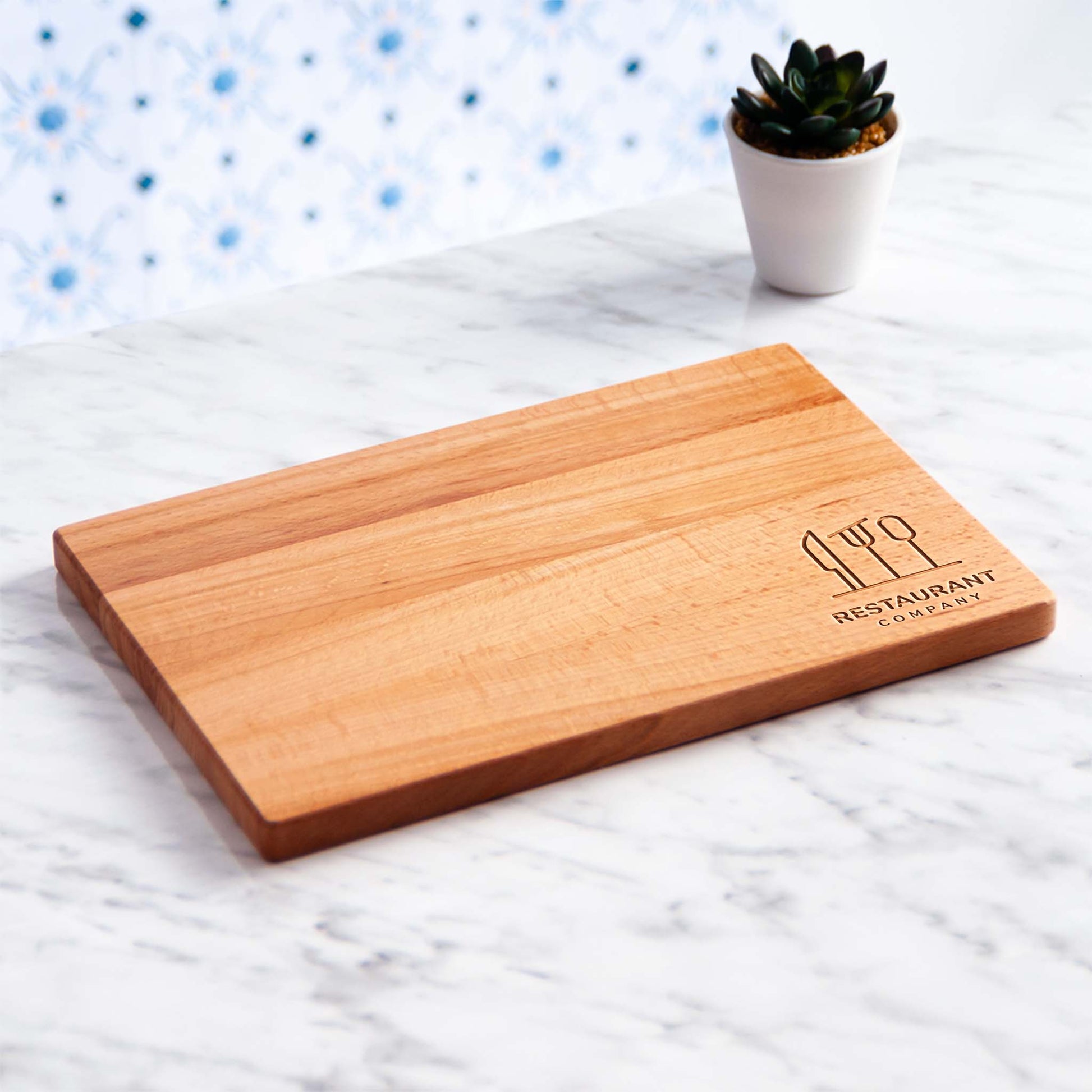 Beech wood cutting board used as charcuterie serving board in restaurant.