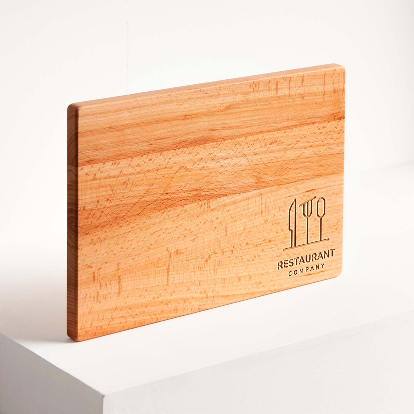 Wooden cutting board with 'Restaurant Company' logo on a white background