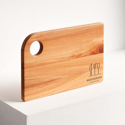 Wooden cutting board with a logo on a white surface