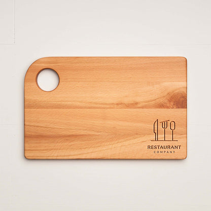 Wooden cutting board with a logo and text on a light background