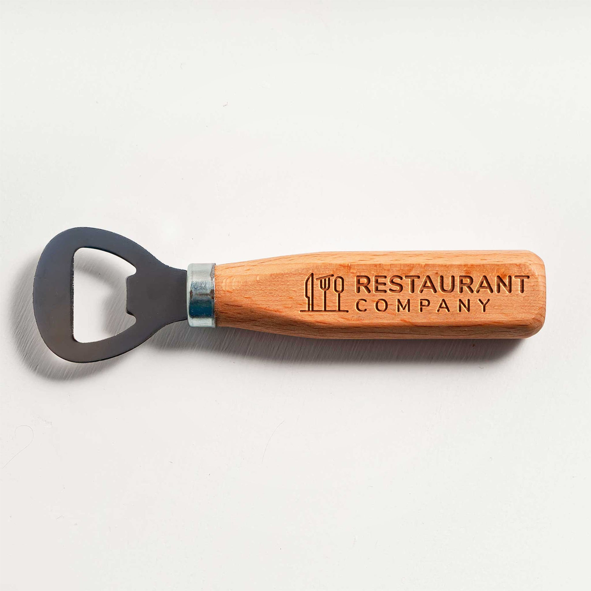 Wooden bottle opener with 'Restaurant Company' engraving on a light gray background