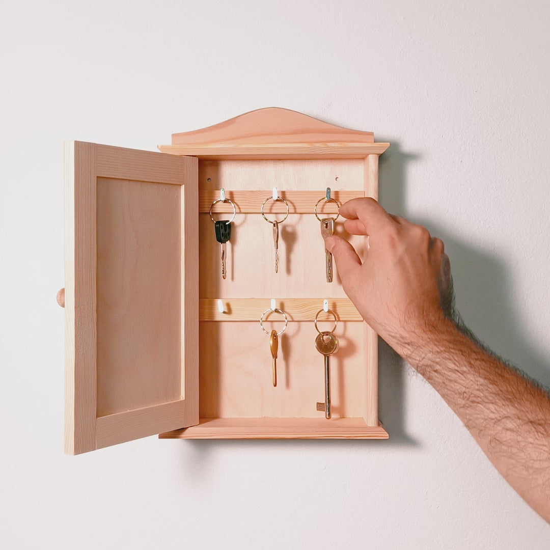 Video of Personalized key holder with engraved family name and decorative hooks.