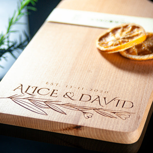 Personalized wooden charcuterie board with leaf branch design and name engraving